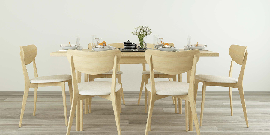 classic wooden dining table with four white wooden chairs